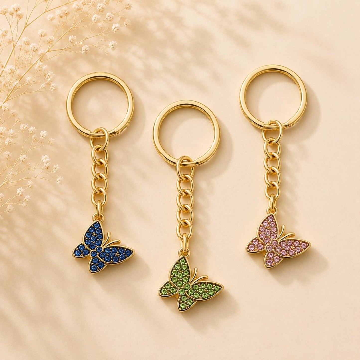 Golden butterfly keychain with blue rhinestones, handmade elegant accessory