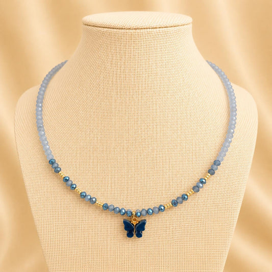 Handmade SKY DANCER BUTTERFLY necklace with blue glass beads, golden accents, and butterfly pendant on gold-plated chain