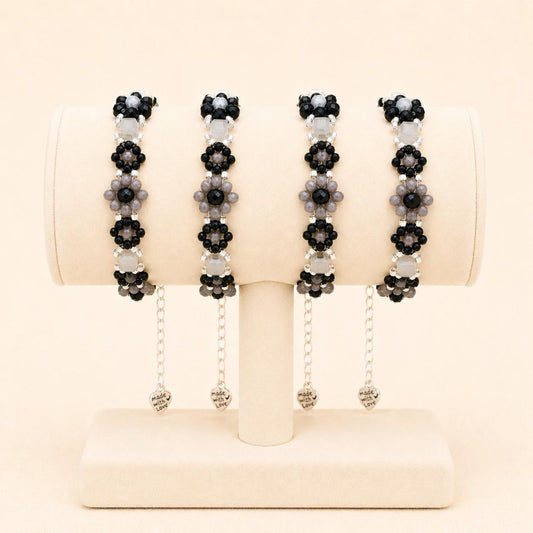 Handmade MIDNIGHT BLOSSOM bracelet with black, grey, and silver beads on stainless steel chain