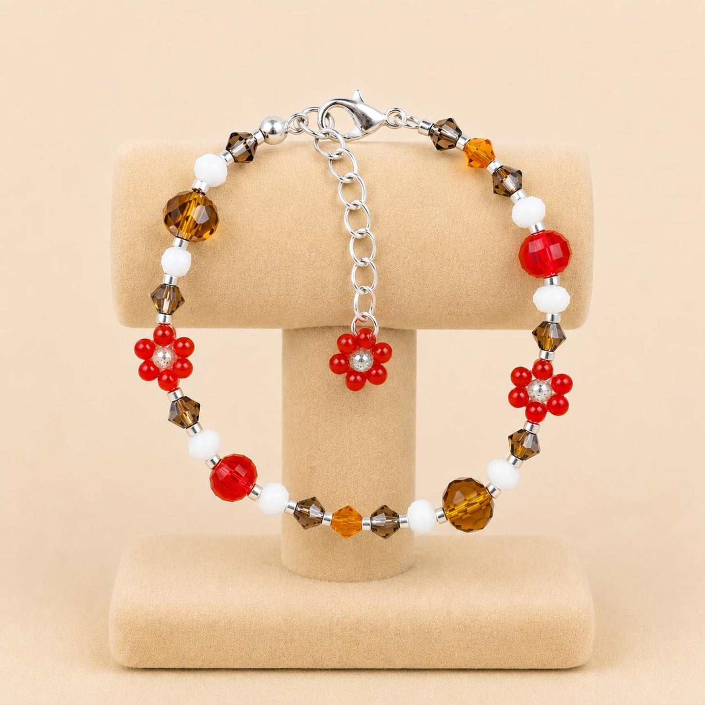 Handmade BRIGHT ESSENCE bracelet with white, brown, orange, red, and beige glass beads and floral accents