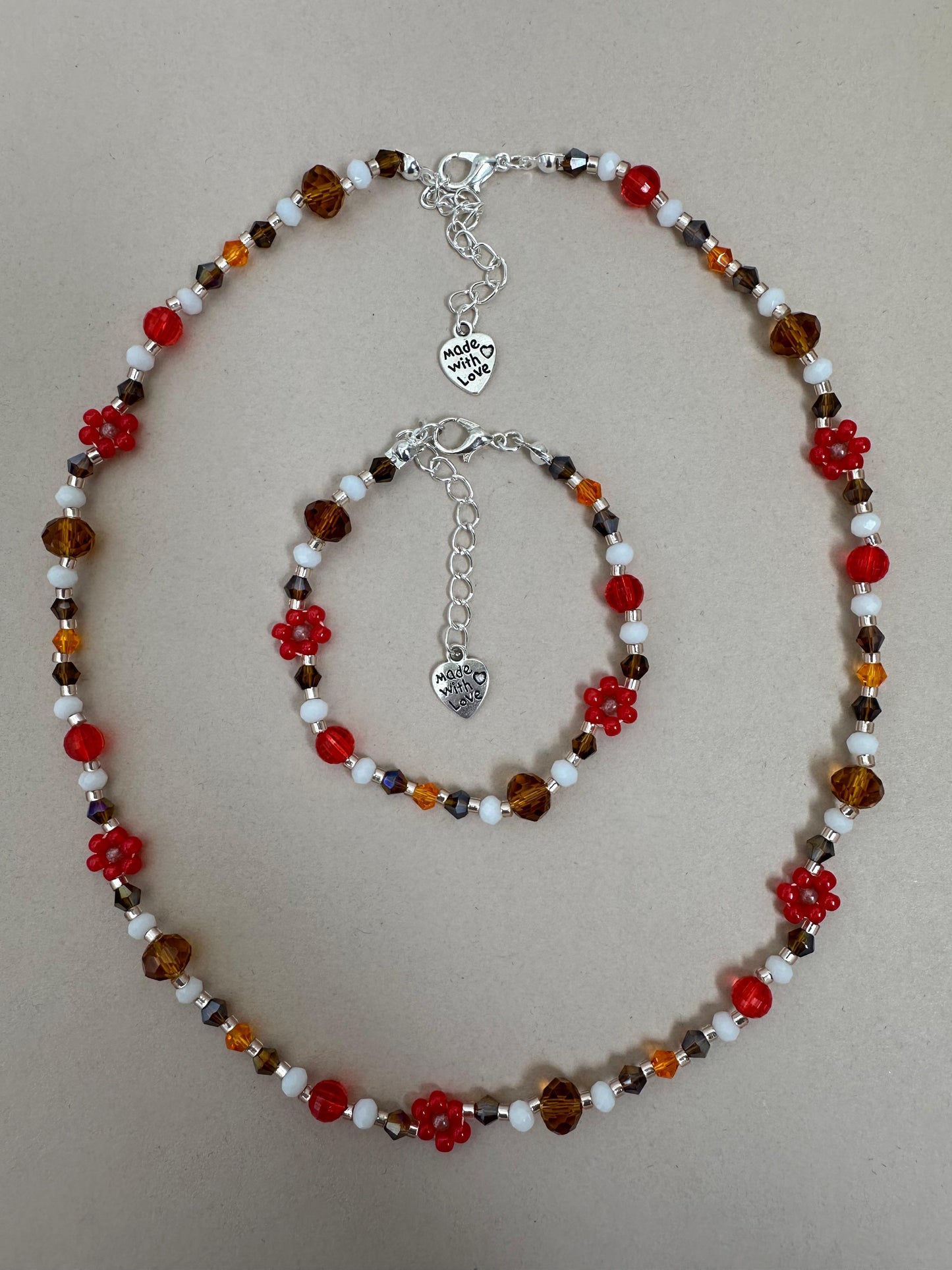 Handmade BRIGHT ESSENCE bracelet with multicolored glass beads and beaded flowers on stainless steel chain