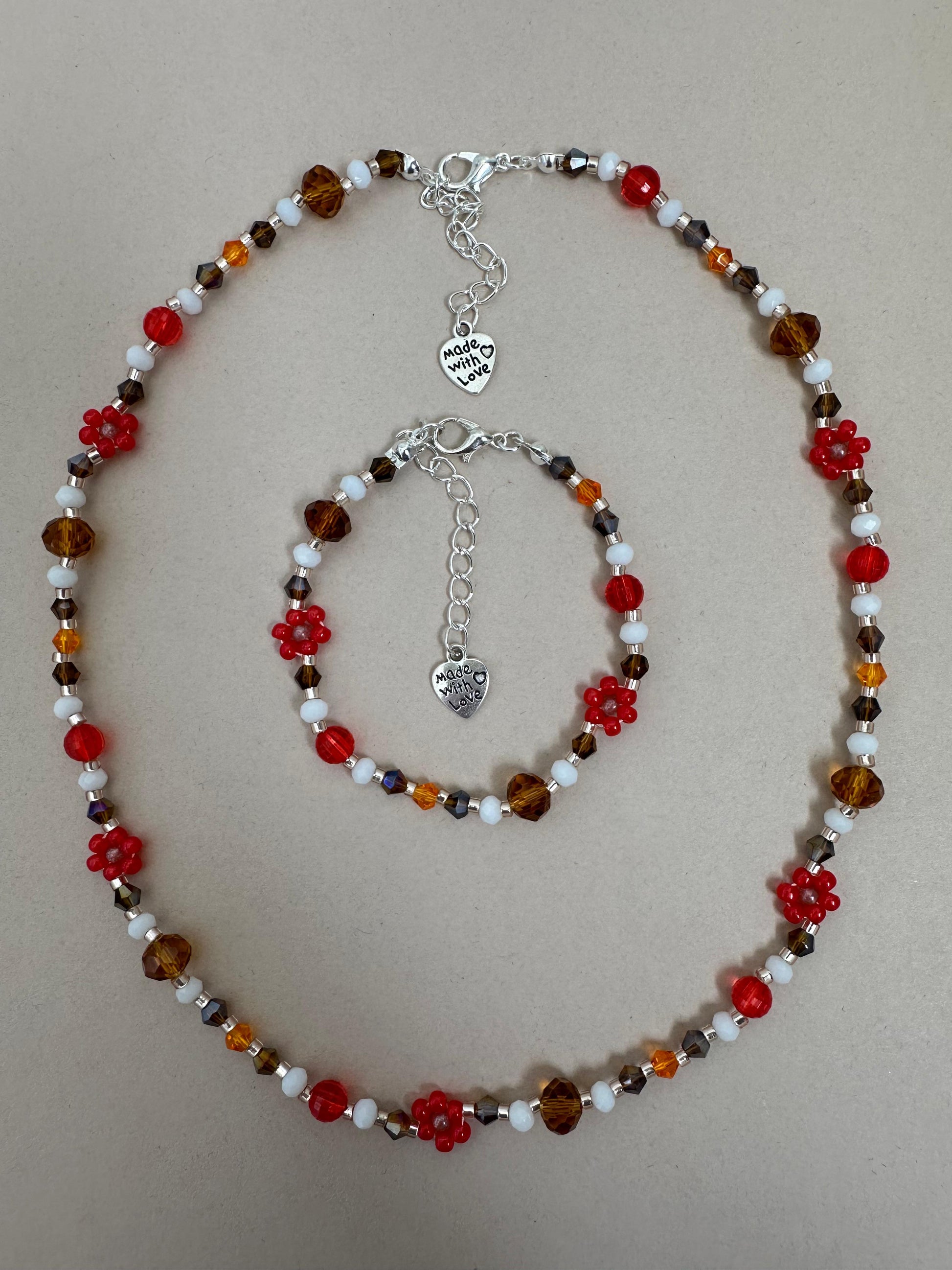 Handmade BRIGHT ESSENCE bracelet with multicolored glass beads and beaded flowers on stainless steel chain