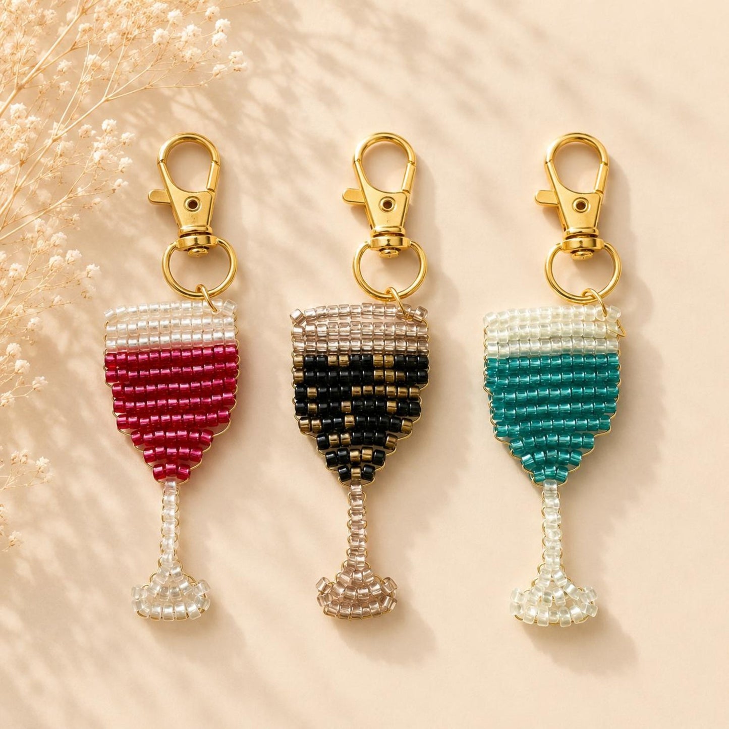 Handmade beaded champagne glass keychain with gold clasp in red, black, or green beads