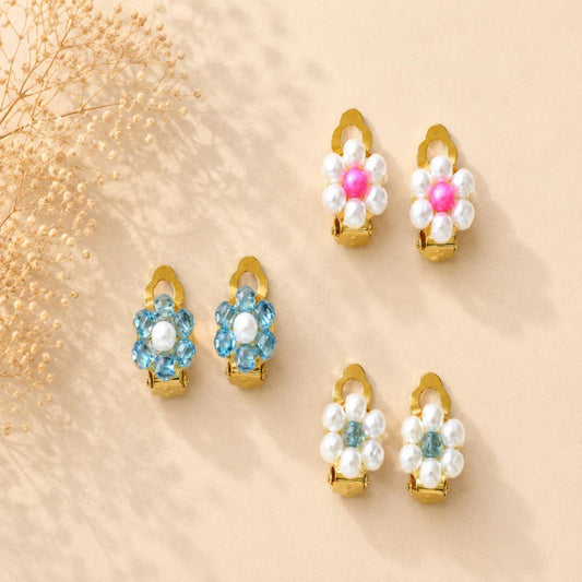 Pearl Blossom clip-on earrings with white petals and blue center beads for non-pierced ears