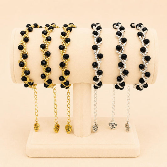 Handmade MIDNIGHT ROMANCE bracelet with black glass beads and gold or silver accents on a stainless steel chain