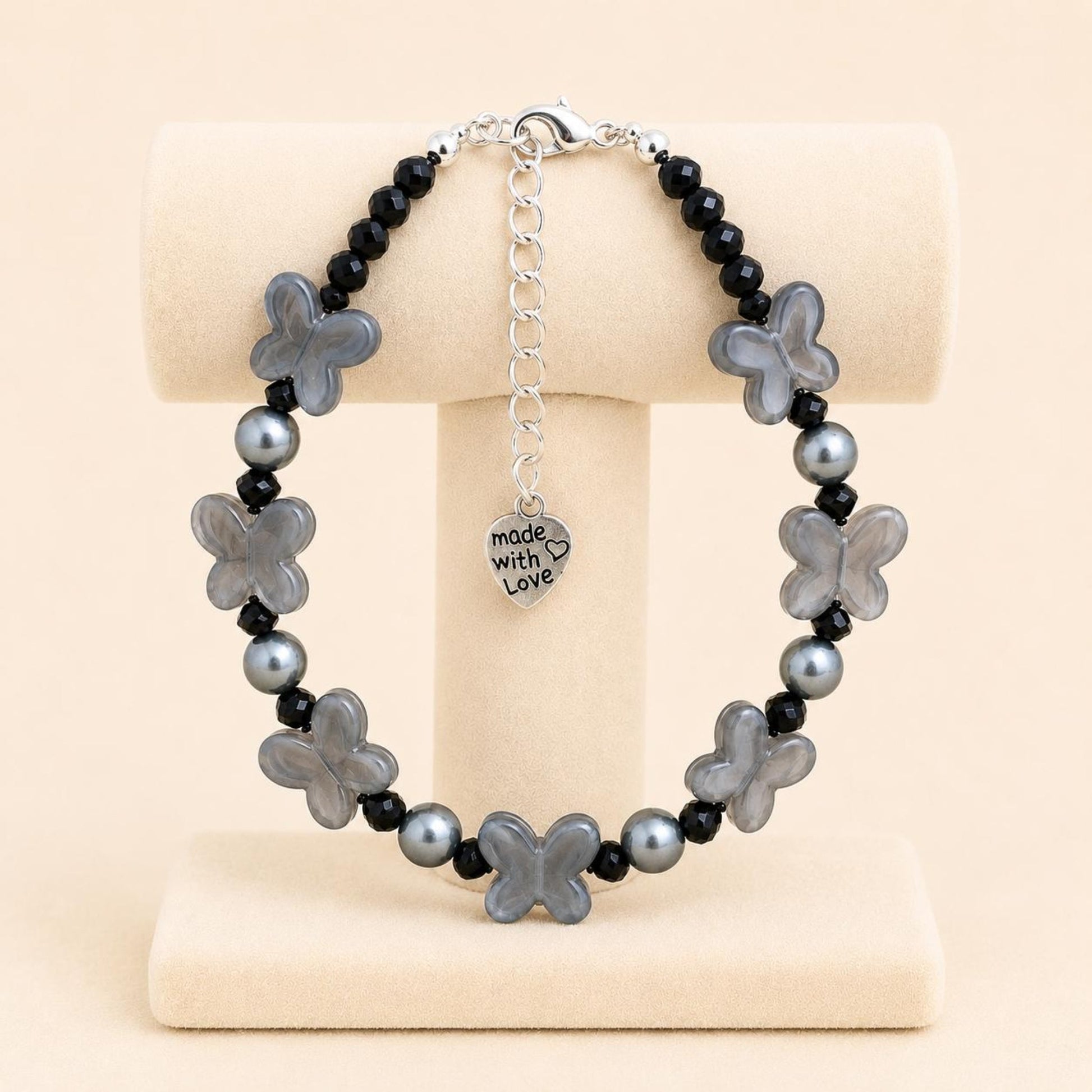 Handmade FLUTTERING Elegance bracelet with black crystal beads, grey faux pearl, and butterfly-shaped beads