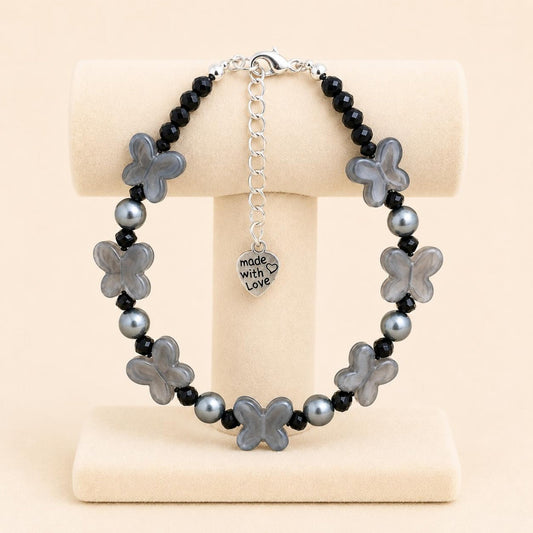 Handmade FLUTTERING Elegance bracelet with black crystal beads, grey faux pearl, and butterfly-shaped beads