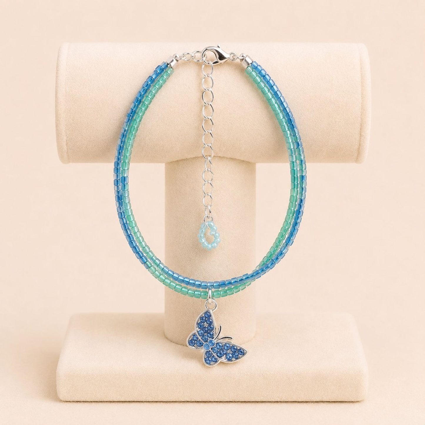 Handmade AZURE GLOW BUTTERFLY bracelet with green and blue Miyuki beads and silver butterfly charm