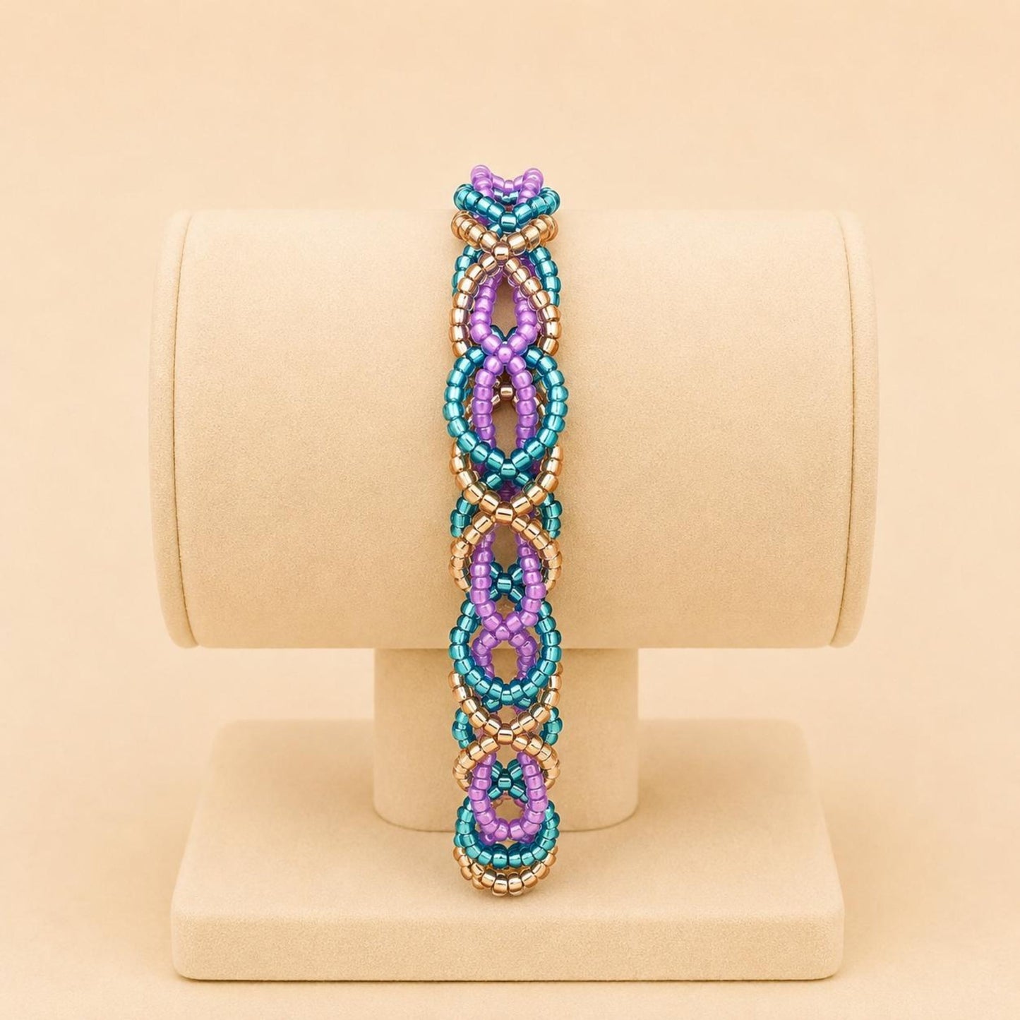 Handmade DREAM WEAVE braided bracelet with lilac, blue, and bronze Miyuki beads and stainless steel clasp