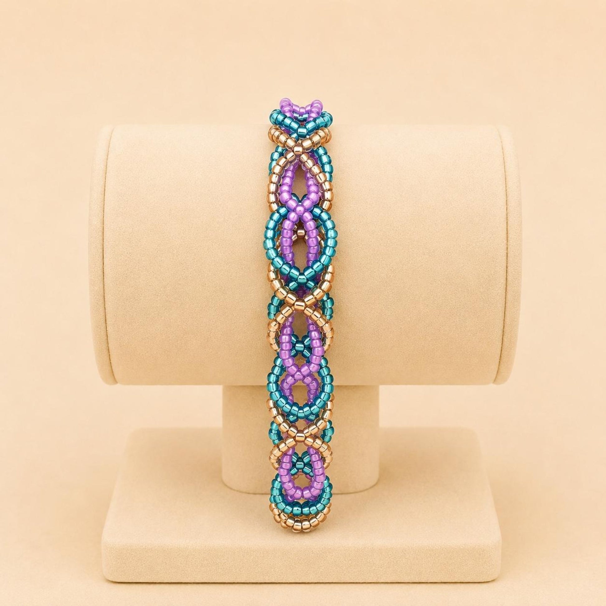 Handmade DREAM WEAVE braided bracelet with lilac, blue, and bronze Miyuki beads and stainless steel clasp
