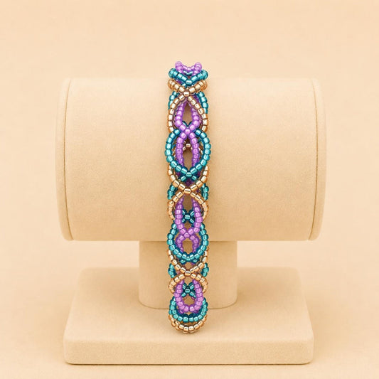 Handmade DREAM WEAVE braided bracelet with lilac, blue, and bronze Miyuki beads and stainless steel clasp