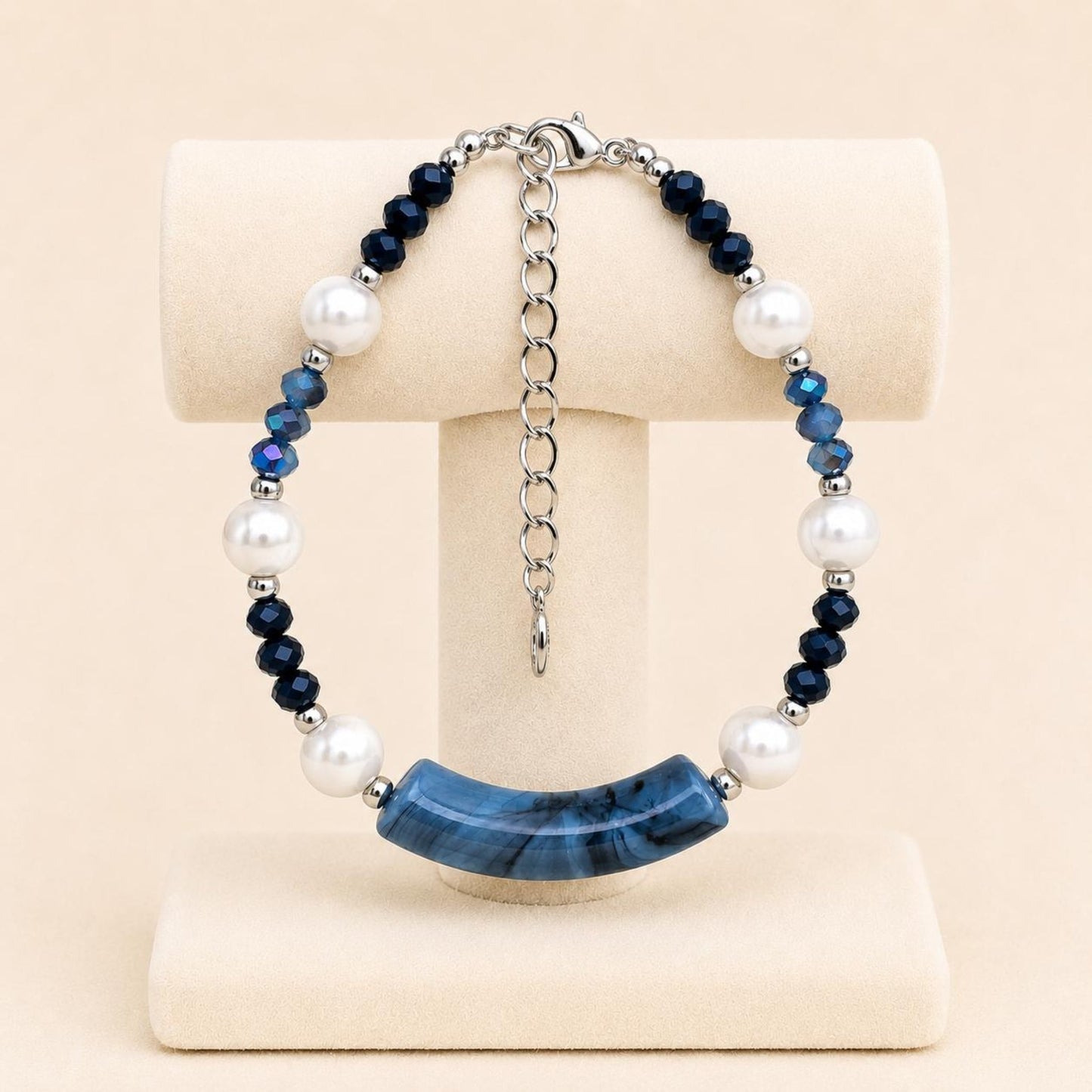 Handmade BLUE PEARL LUXURY bracelet with white faux pearls, blue crystal beads, and silver accents on a stainless steel chain