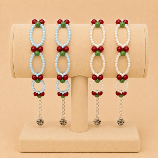 CHERRY BLOOM Handmade Bracelet with red, green, baby blue, and white glass beads on nylon cord with stainless steel clasp