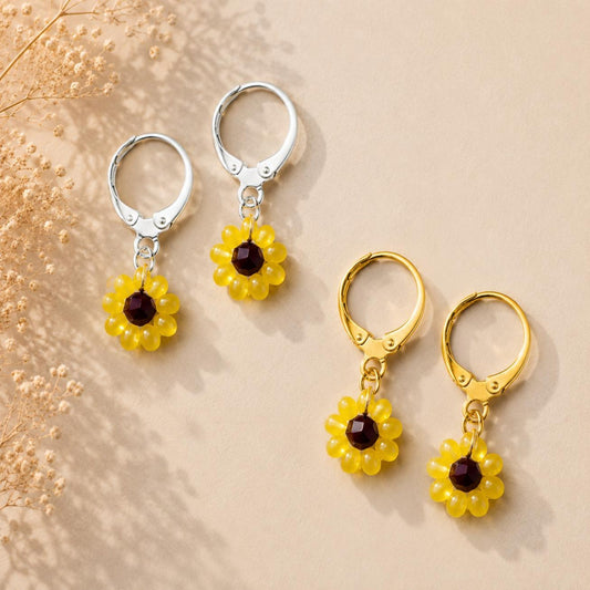 Handmade SUNFLOWER BLOOM earrings with yellow, brown, and green beads on gold and silver stainless steel hoops