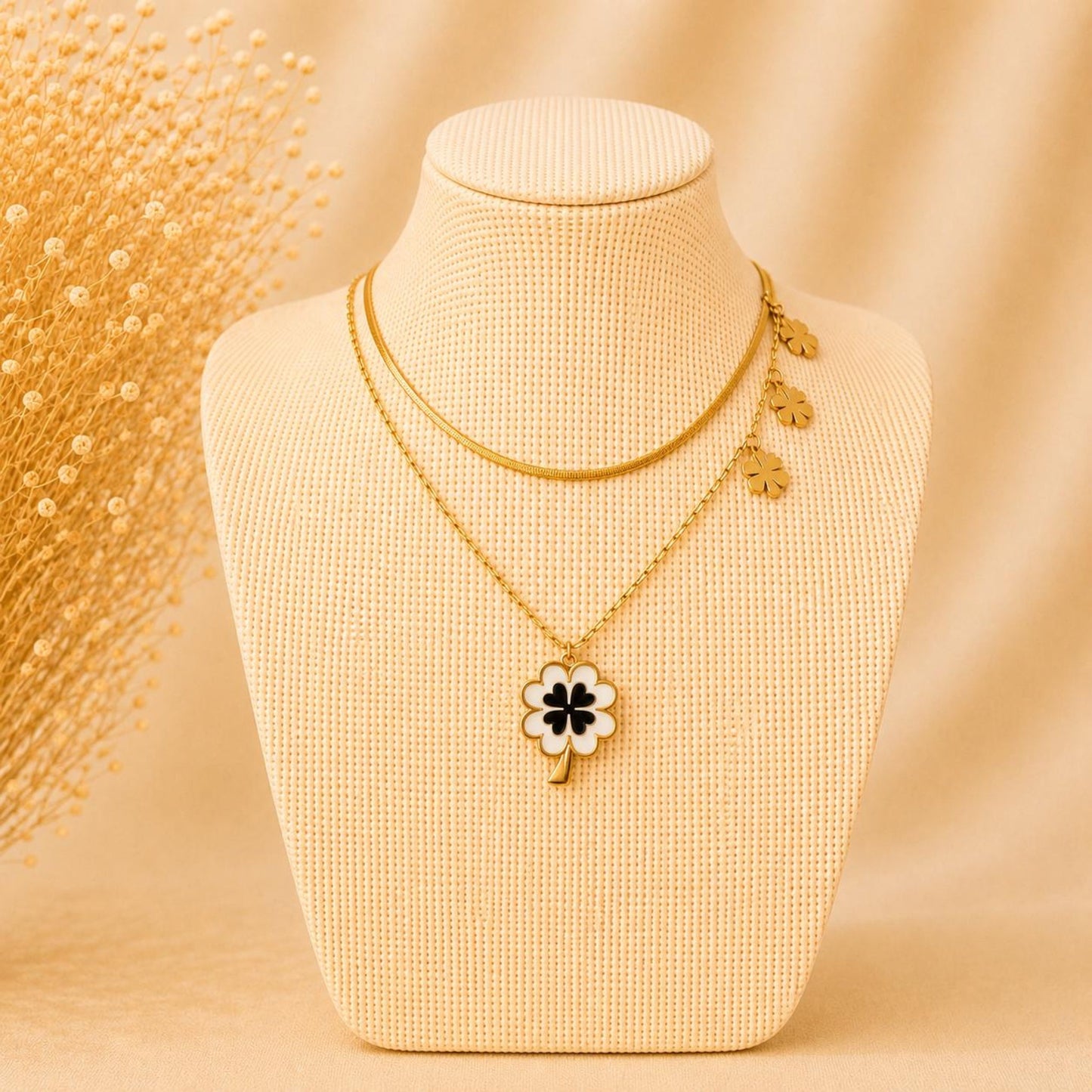 Golden stainless steel necklace with four-leaf pendant, adjustable chain, waterproof and tarnish-free design