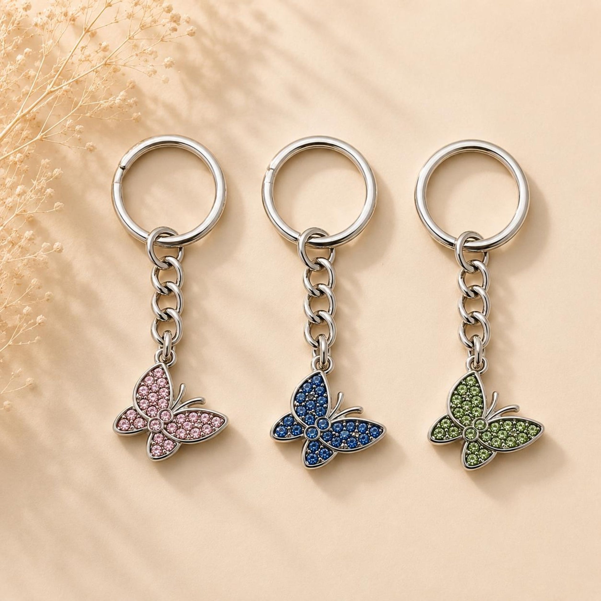 Silver butterfly keychain with blue rhinestones and gold clasp handcrafted accessory