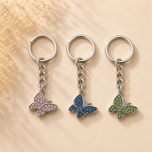 Silver butterfly keychain with blue rhinestones and gold clasp handcrafted accessory