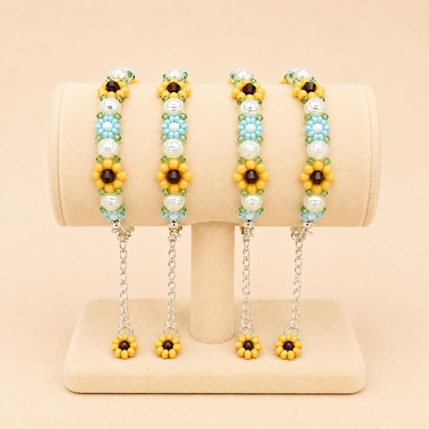 Elegant floral bloom handmade bracelet with blue, white, orange, and green beads on stainless steel chain