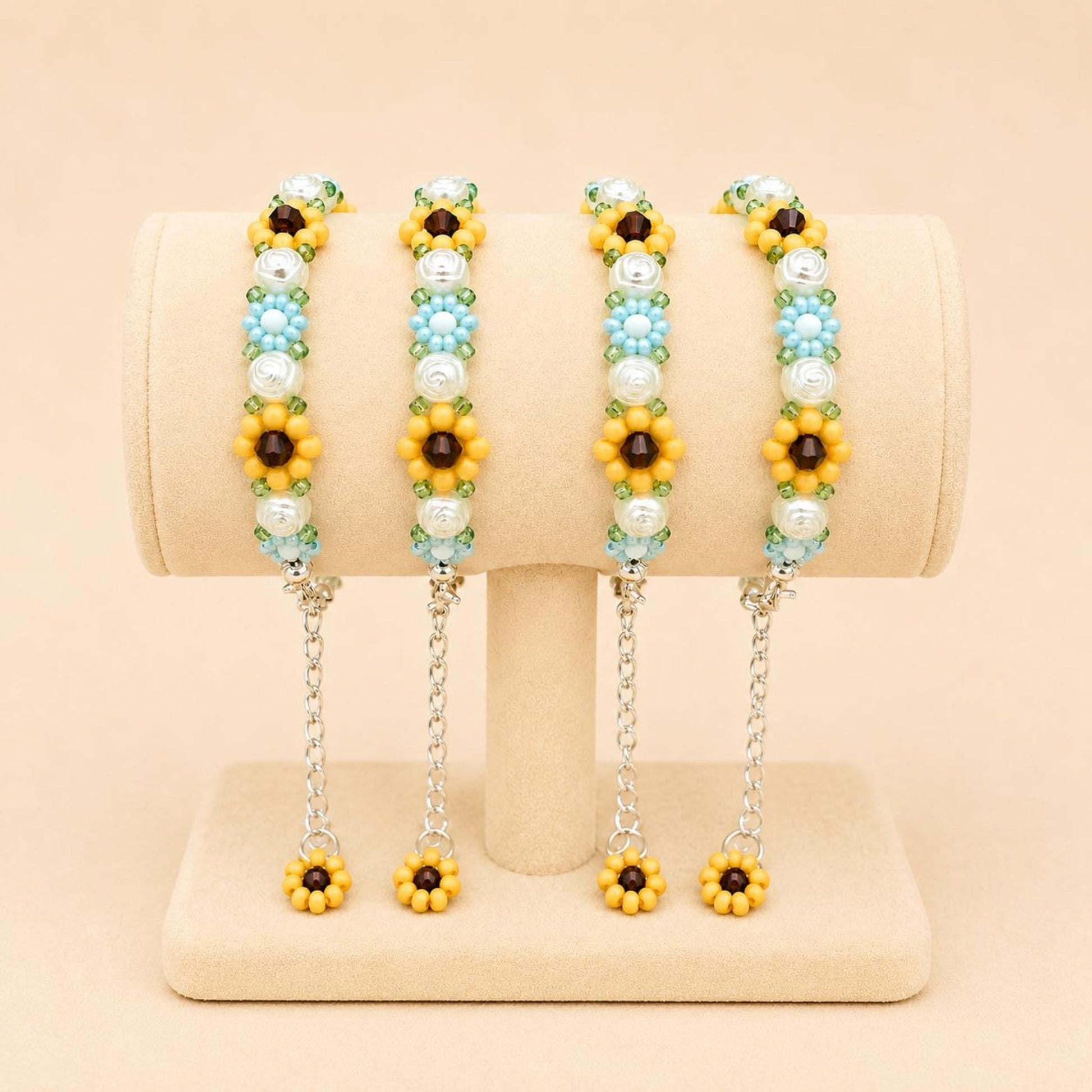 Elegant floral bloom handmade bracelet with blue, white, orange, and green beads on stainless steel chain