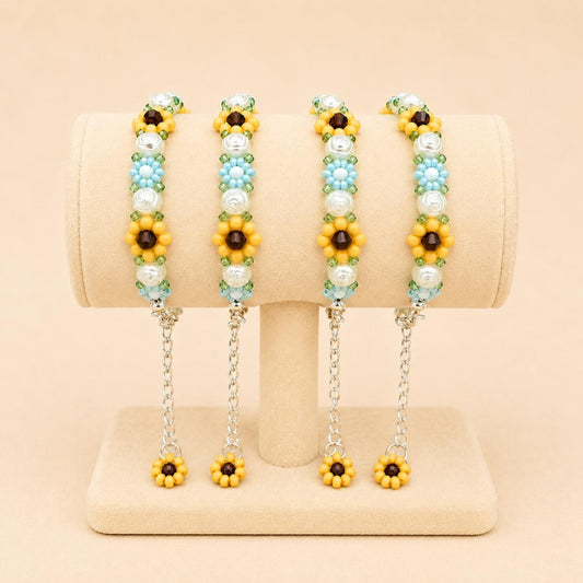 Elegant floral bloom handmade bracelet with blue, white, orange, and green beads on stainless steel chain