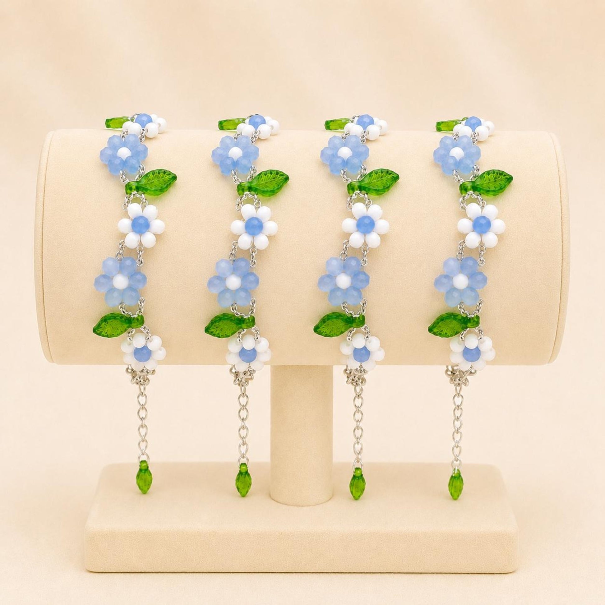 Handmade EVERYDAY FLORAL bracelet with white and blue glass beads, silver seed beads, and green leaf accents