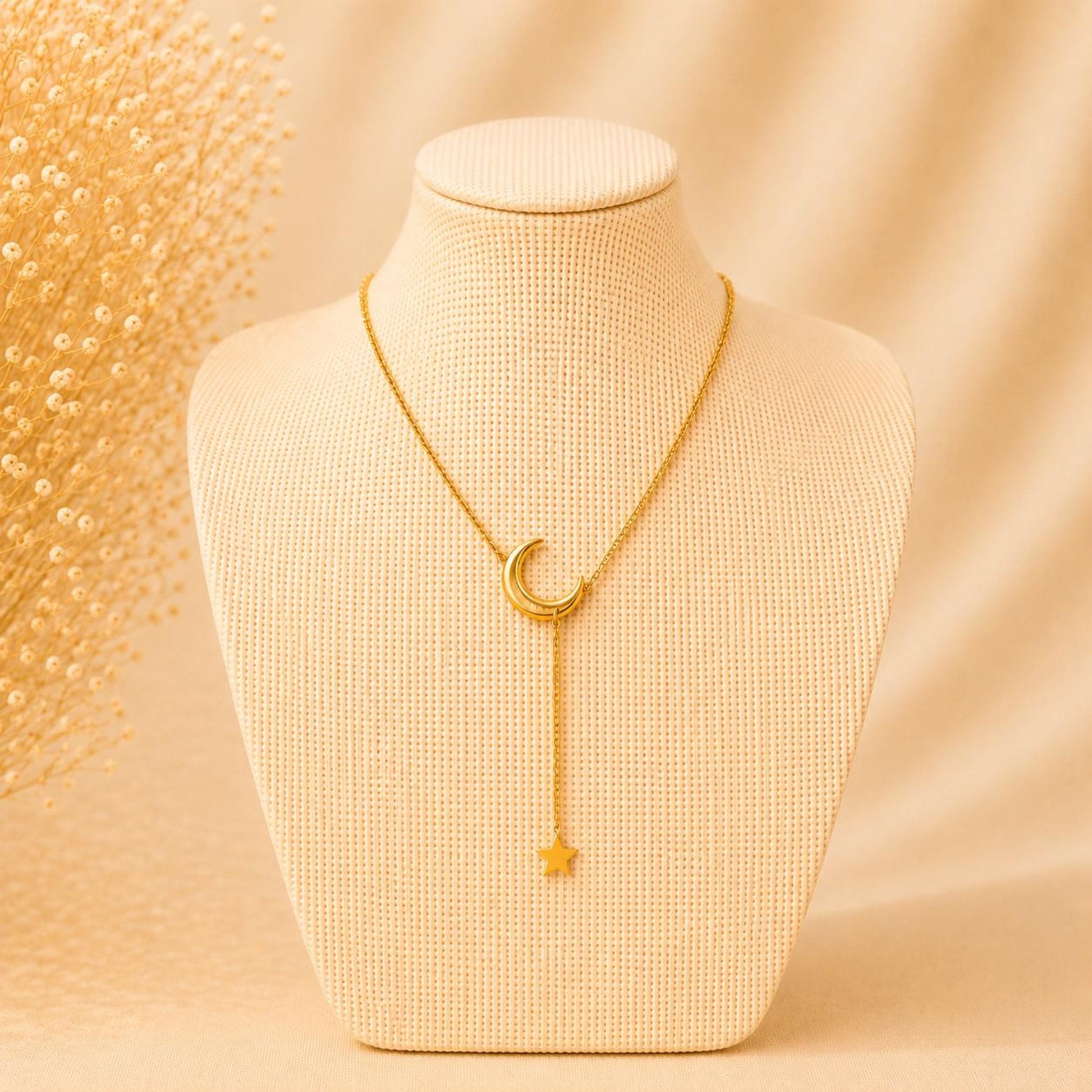 Elegant stainless steel necklace with crescent moon and dangling star pendant
