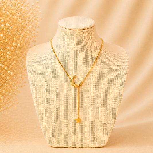 Elegant stainless steel necklace with crescent moon and dangling star pendant