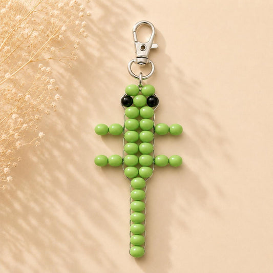 Handmade green lizard beaded keychain with silver clasp