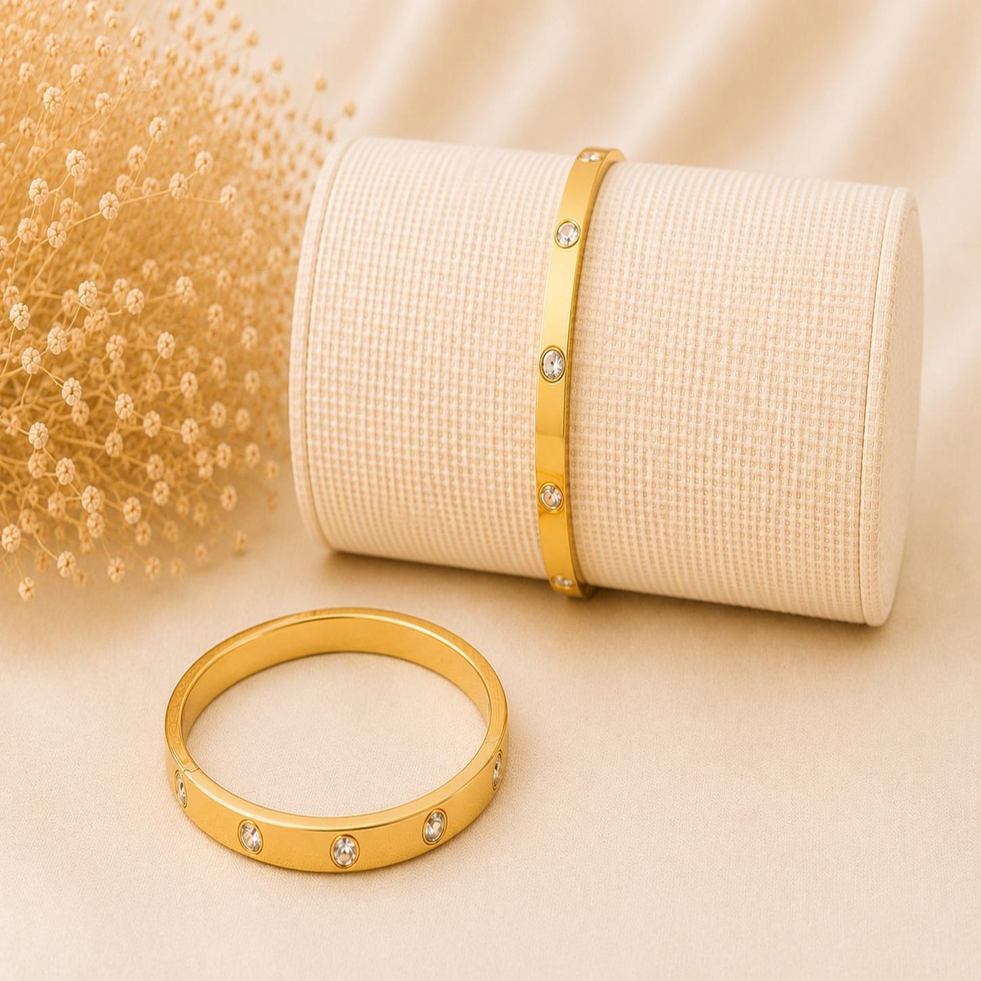 Golden adjustable ANDA bangle bracelet with clear stones, premium stainless steel, and elegant cable wire design