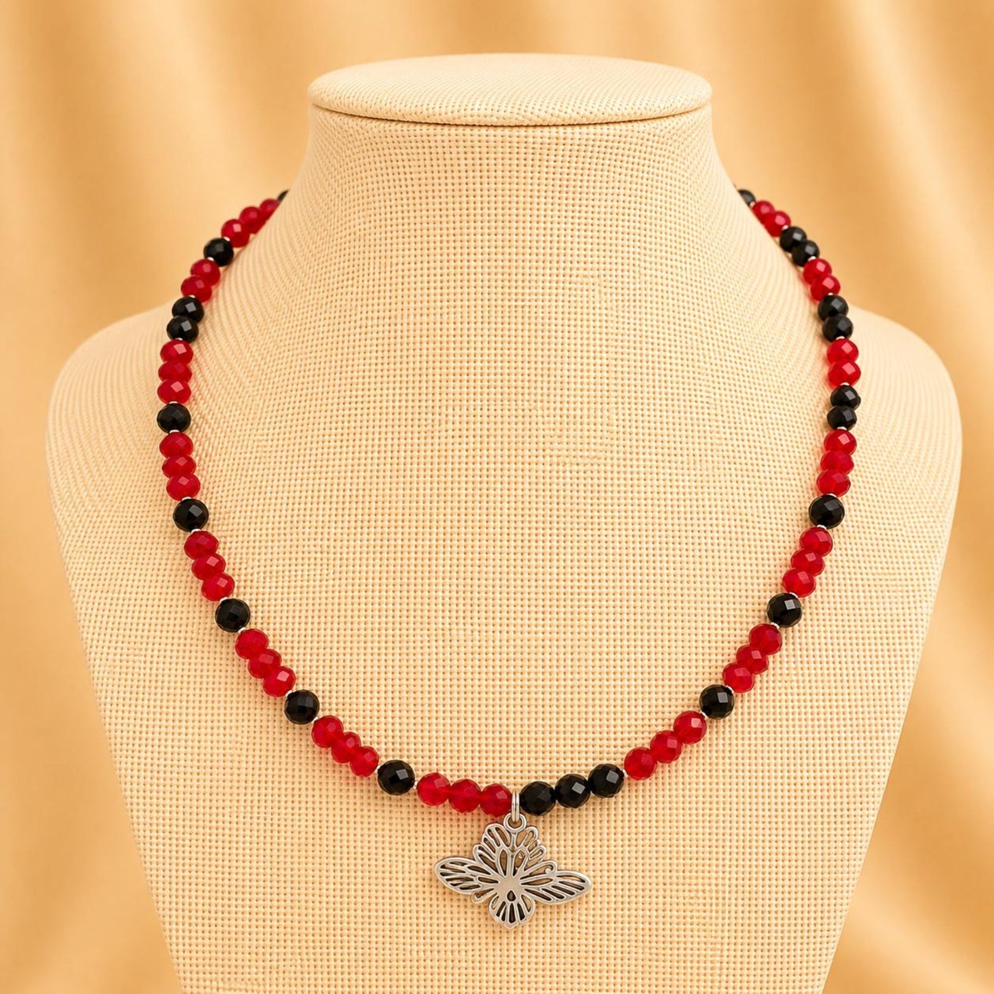 Handmade ARIELLA necklace with red and black crystal beads and silver butterfly design