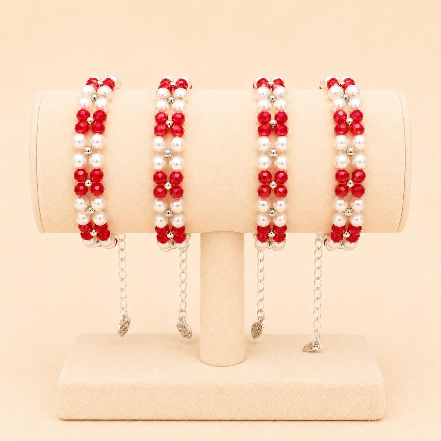 Handmade ETERNAL BALANCE bracelet with red crystal beads, ivory faux pearls, and silver accents