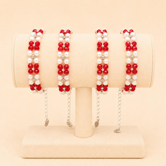 Handmade ETERNAL BALANCE bracelet with red crystal beads, ivory faux pearls, and silver accents