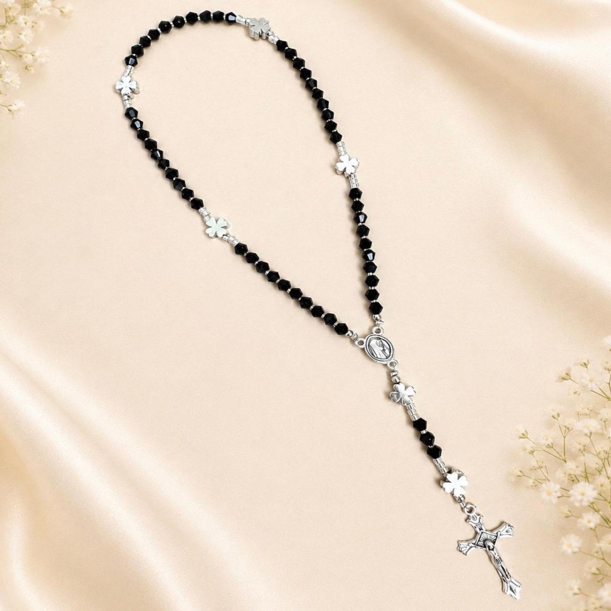Black Grace Handmade Rosary with black crystal beads, silver-tone accents, and four-leaf clover spacers