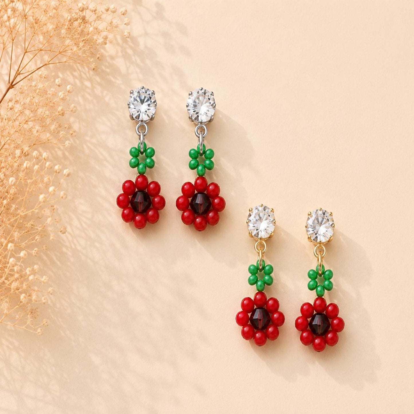 Red Blossom earrings with red, brown, and green beads, gold and silver options