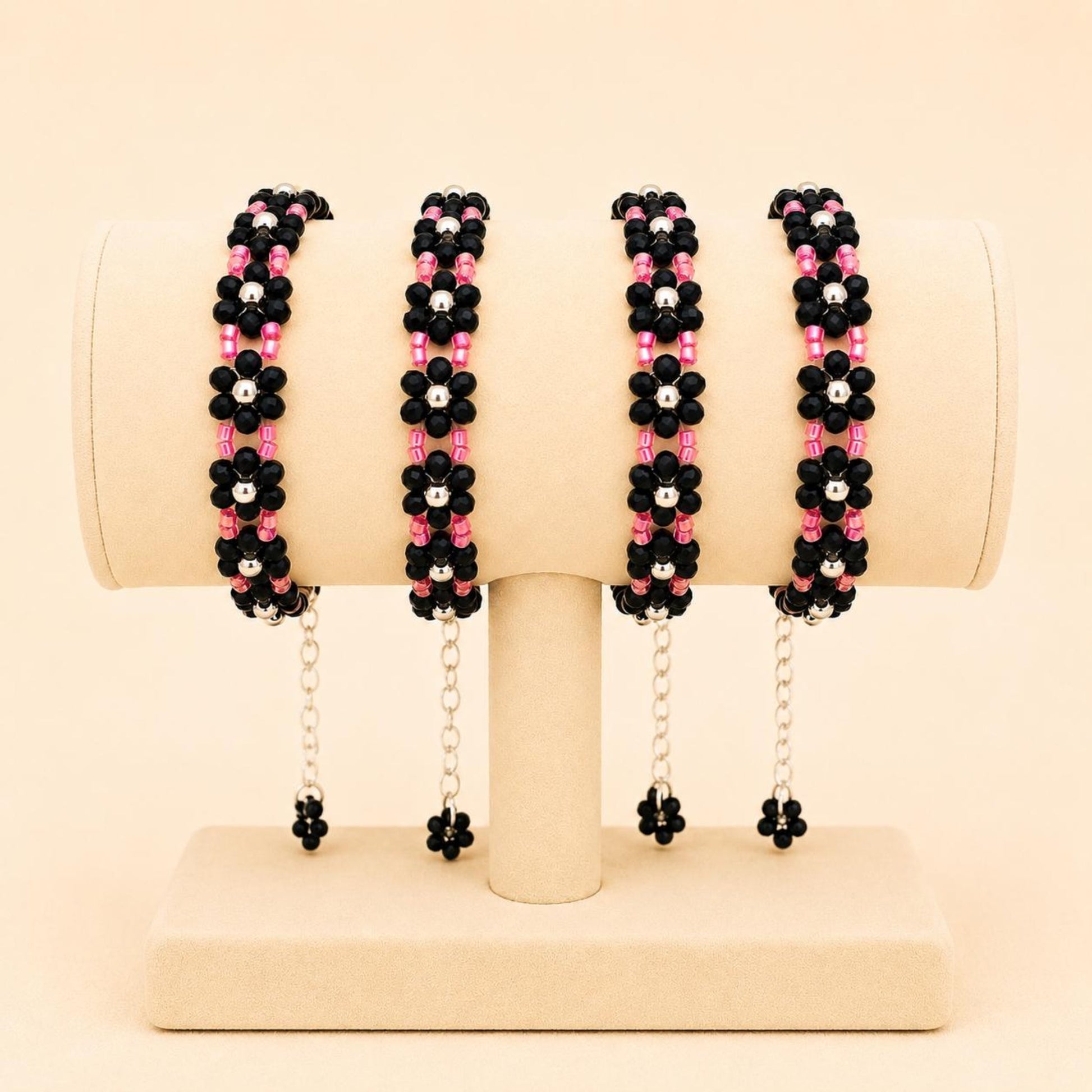 NOIR BLOSSOM handmade bracelet with black, silver, and red beads on nylon string with stainless steel clasp