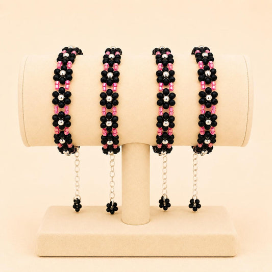 NOIR BLOSSOM handmade bracelet with black, silver, and red beads on nylon string with stainless steel clasp