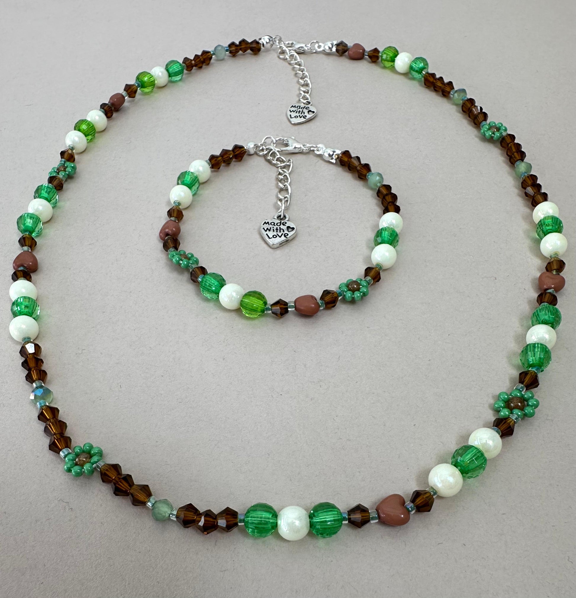 Handmade MORNING DEW bracelet with brown and green beads, floral details, and stainless steel clasp