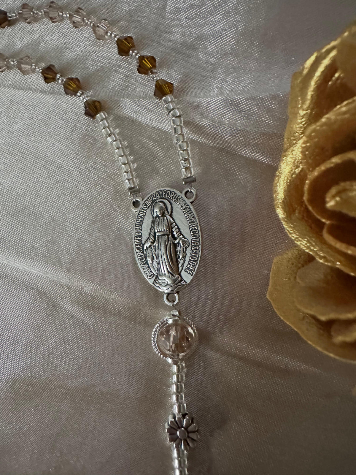Amber & Champagne Handmade Rosary with amber faceted beads, silver-tone seed beads, floral spacer, and Virgin Mary centerpiece