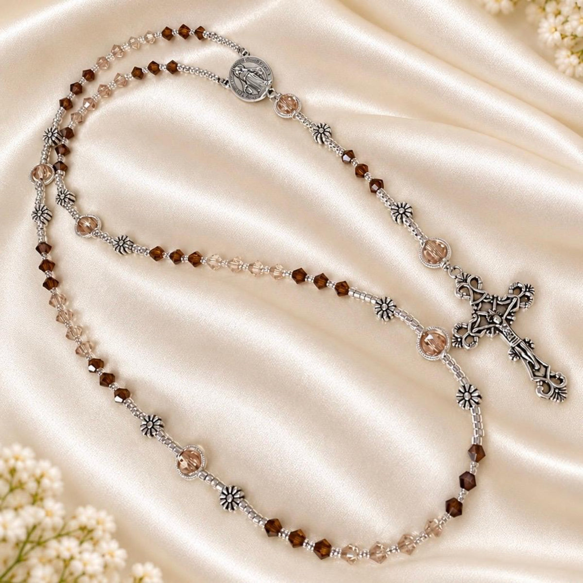 Amber & Champagne Handmade Rosary with faceted amber and champagne crystal beads, silver-tone flower spacers and crucifix.