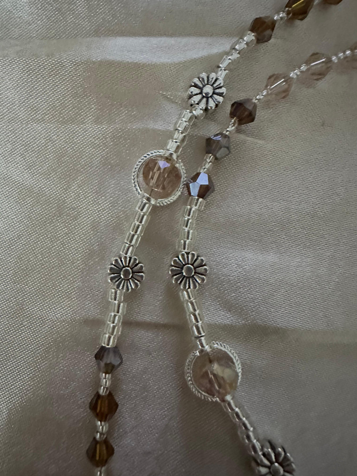 Amber & Champagne Handmade Rosary with faceted amber and champagne crystals, silver-tone flower spacers and round settings.