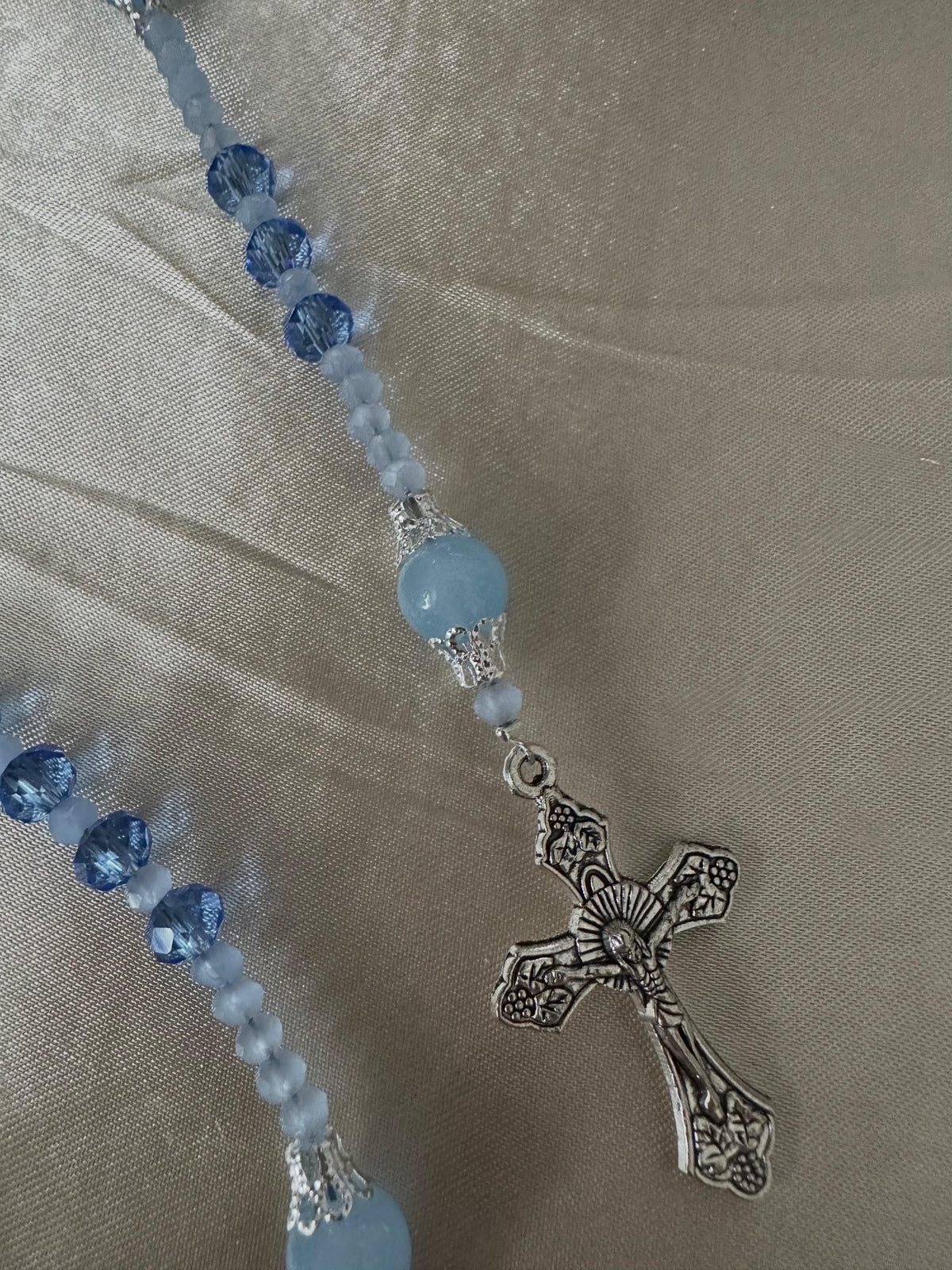 Blue Serenity Handmade Rosary with dark and pale blue glass beads, silver-tone filigree accents, and ornate crucifix.