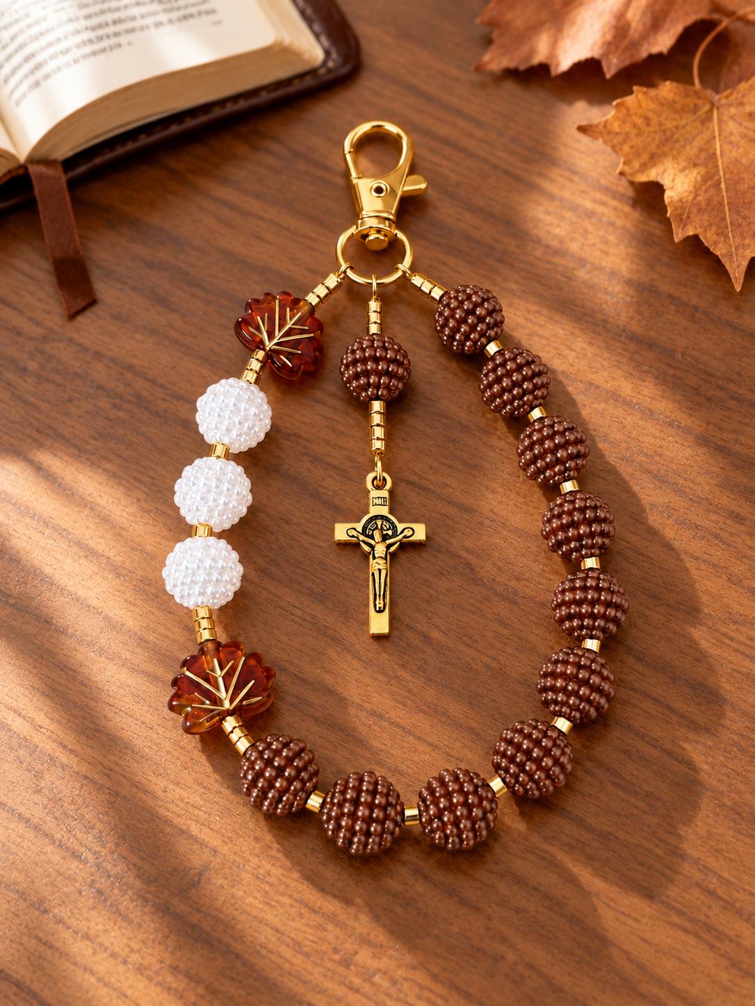 Cocoa Grace Handmade Catholic Keychain with brown and white textured beads, amber leaf accents, and gold-tone crucifix