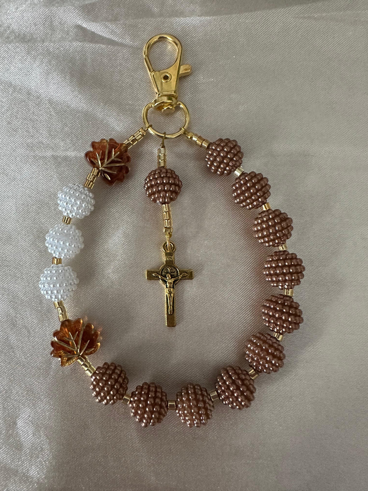 Cocoa Grace Handmade Catholic Keychain with brown and white textured beads, amber leaf accents, and gold-tone crucifix