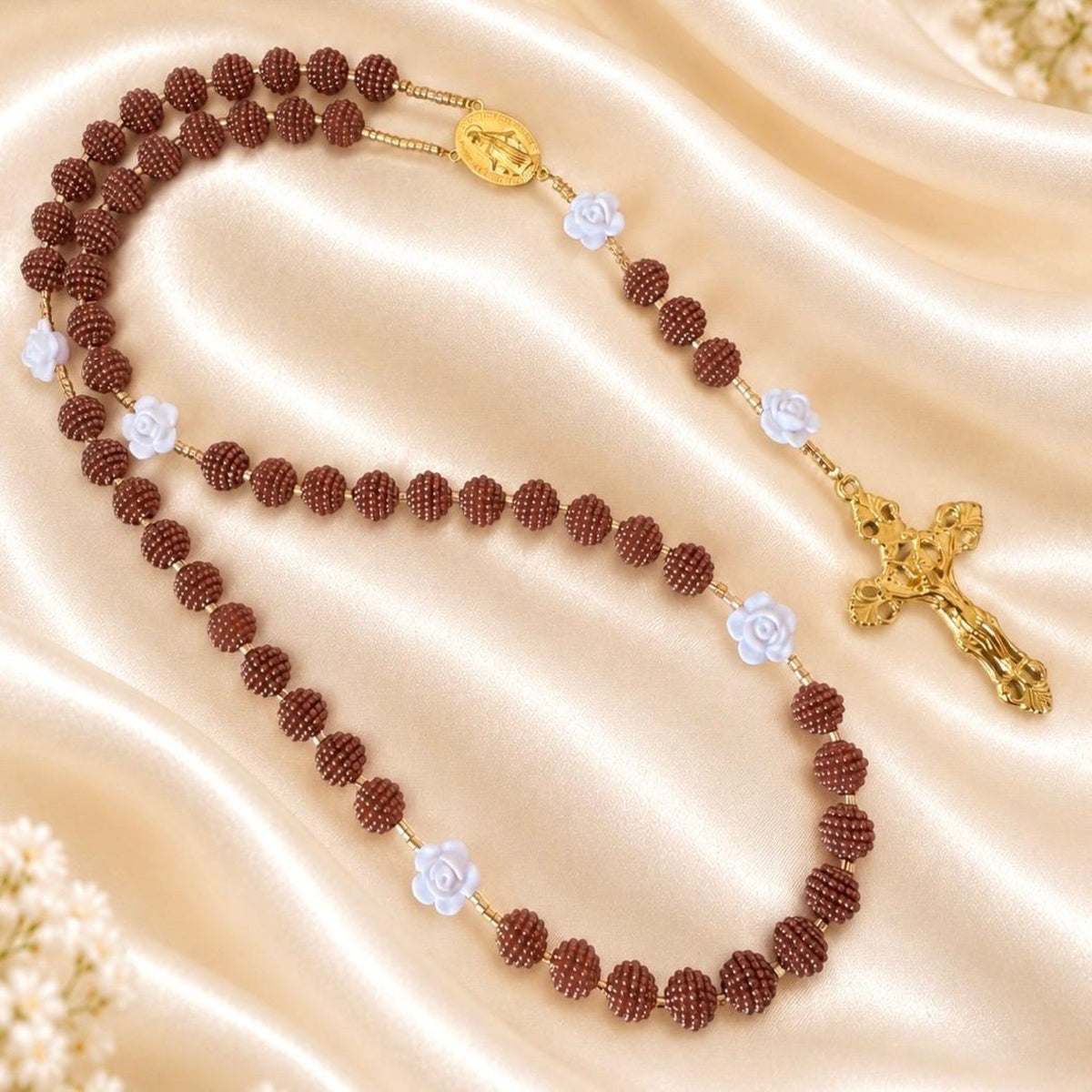 Cocoa Grace Handmade Rosary with textured brown beads, white rose accents, gold-tone links, Mary centerpiece and crucifix.