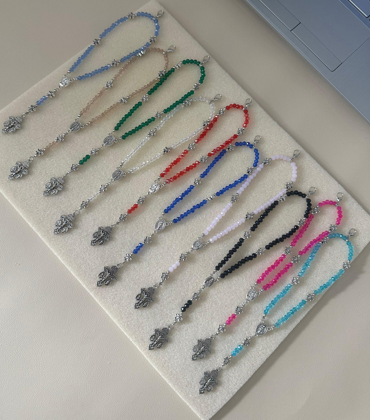 Grace in Bloom Silver-Tone rosary bracelet with faceted glass beads in assorted colours, silver-tone floral accents and crucifix.