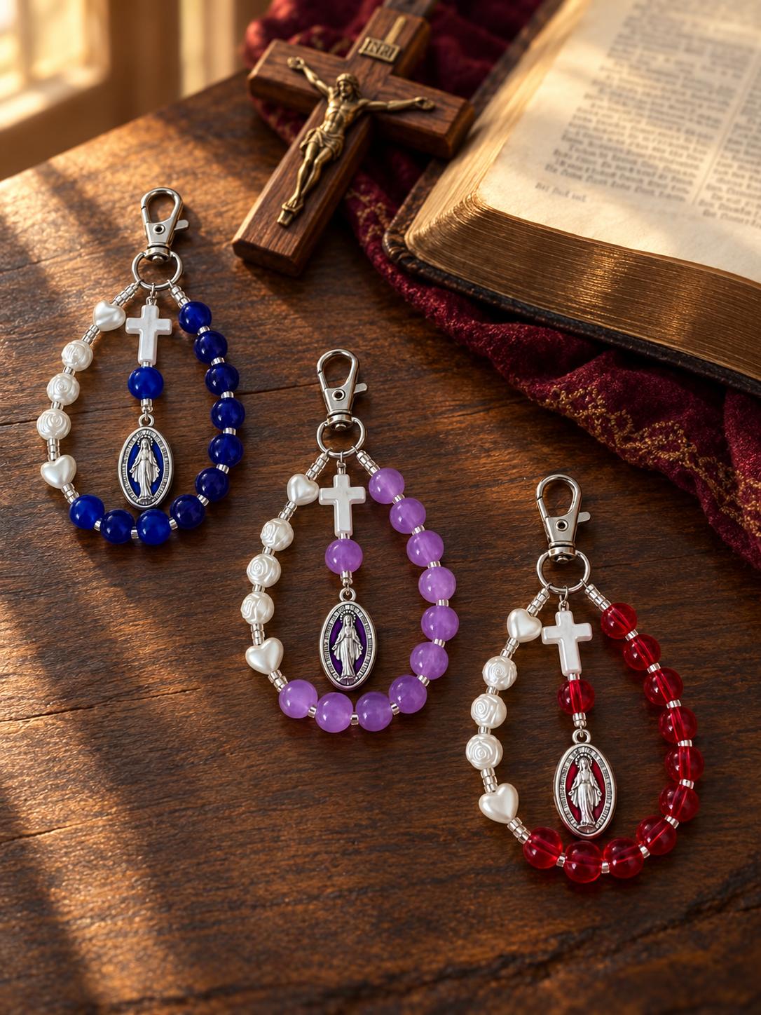 Mary’s Grace Handmade Catholic Keychain with blue, purple, and red glass beads, ivory rose and heart beads, and a cross and Mary medal