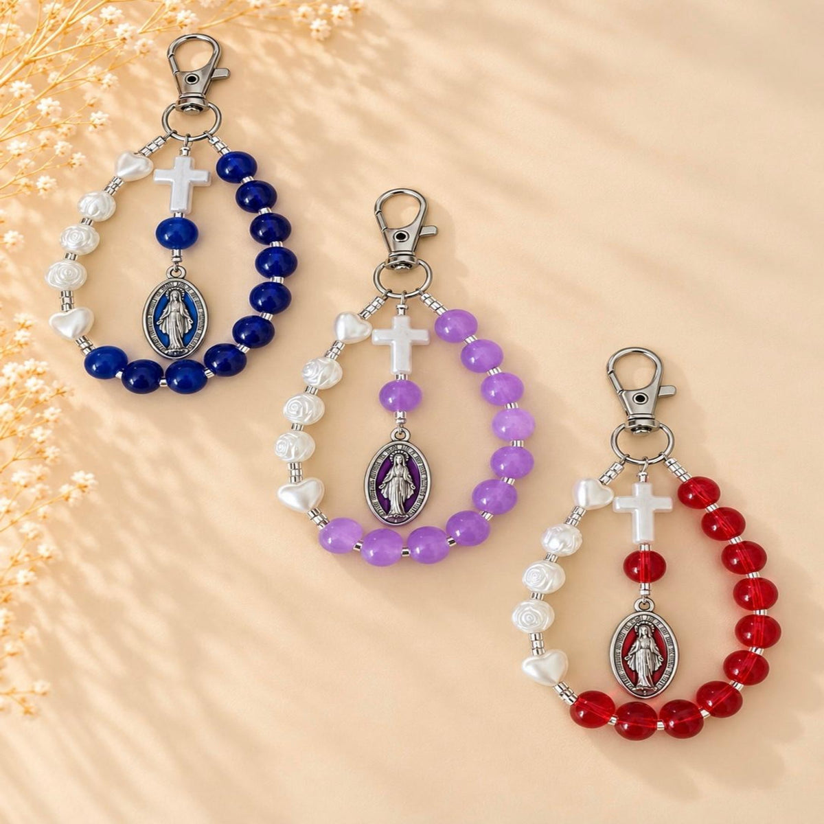 Mary’s Grace Handmade Catholic Keychain with glossy blue, purple, and red glass beads, ivory rose and heart beads, cross and Mary medals.