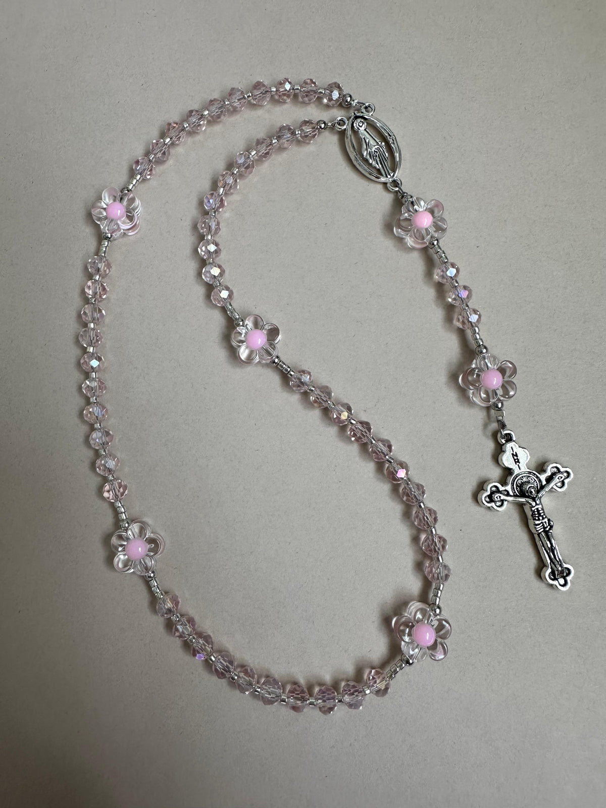 Pink Blossom Handmade Rosary with pink crystal glass beads, transparent acrylic flower beads with pink centers, and silver tone crucifix