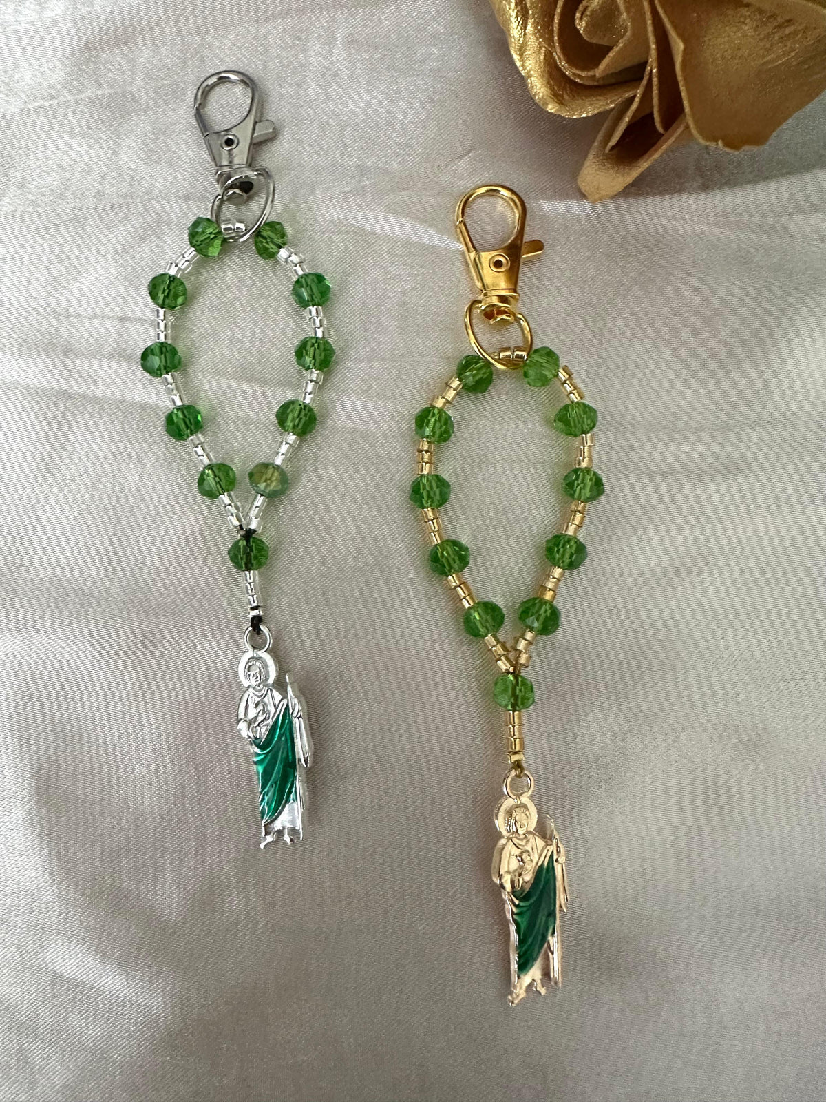 Sacred Hope Handmade Catholic Keychain with green faceted beads, metallic accents, and a robed religious charm in silver or gold tone.