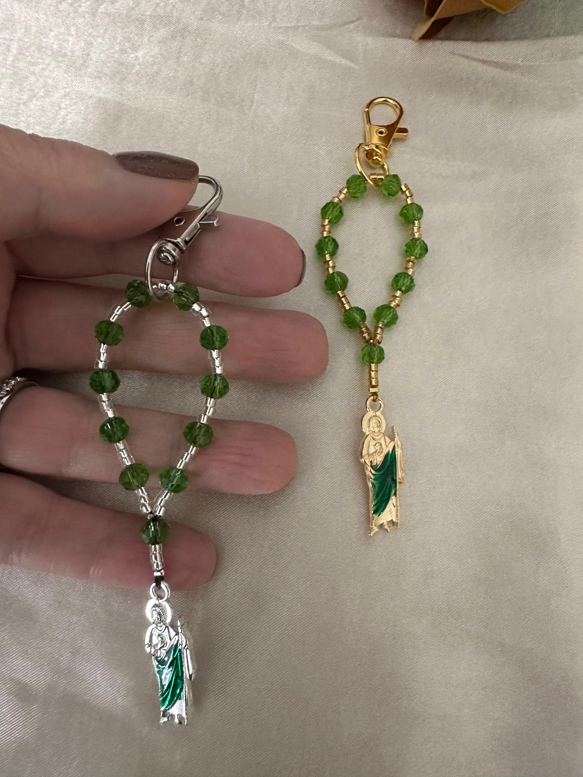 Sacred Hope Handmade Catholic Keychain with green faceted beads, silver spacers, and a green-robed religious charm.